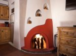 Authentic kiva fireplace in the living room, available Oct 15-Apr 15